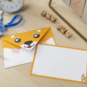 Biglietto augurale Corgi su scrivania